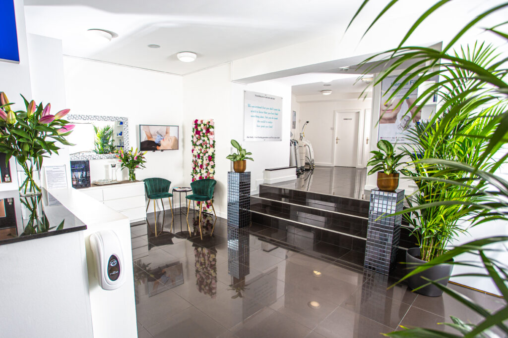 Bright, welcoming clinic lobby with modern décor and greenery.